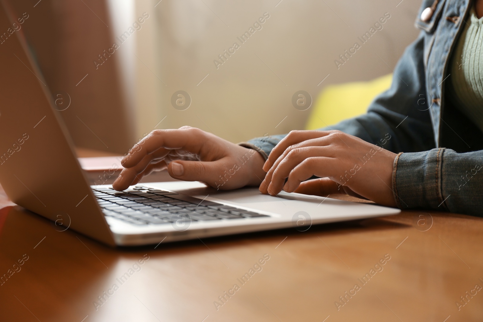 Photo of Blogger working with laptop in cafe, closeup