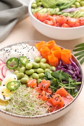 Delicious poke bowls with vegetables, fish and edamame beans on light table, closeup