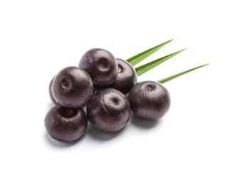 Photo of Fresh acai berries with leaves on white background