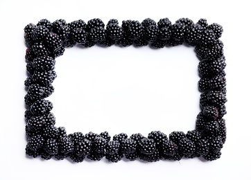 Frame of ripe blackberries on white background, flat lay. Space for text