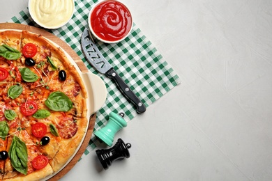 Photo of Flat lay composition with tasty homemade pizza and space for text on table