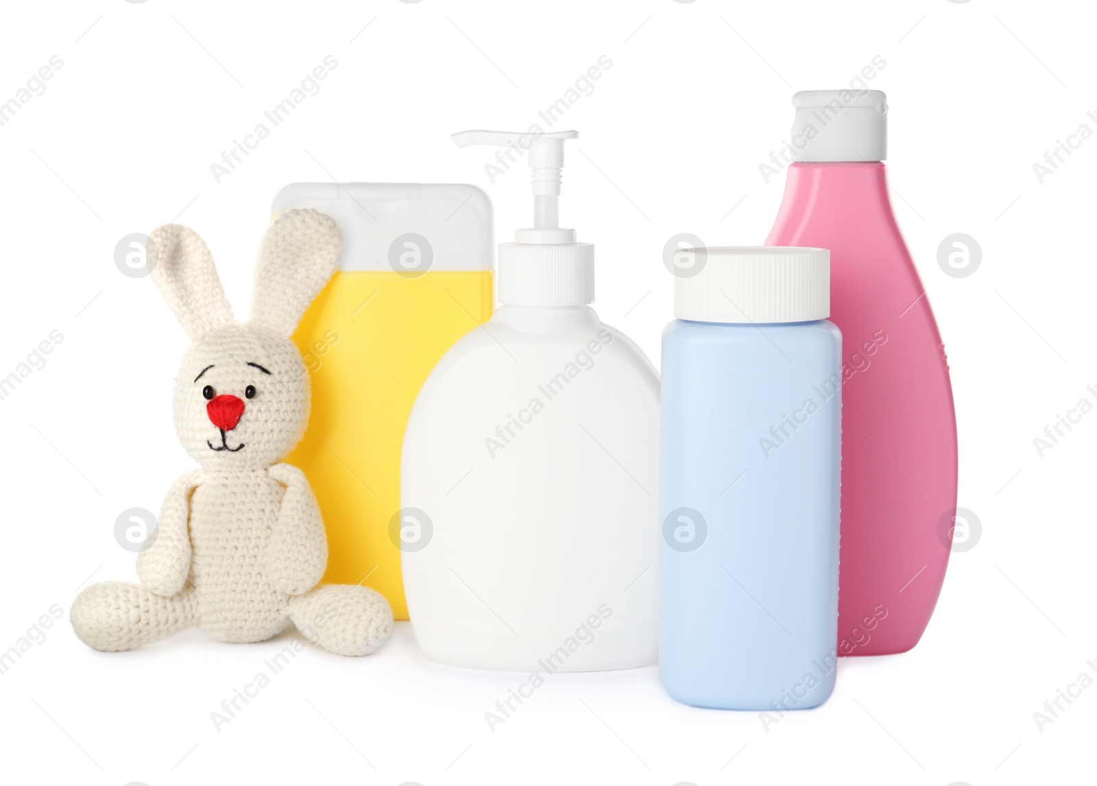Photo of Set of baby cosmetic products and toy bunny on white background