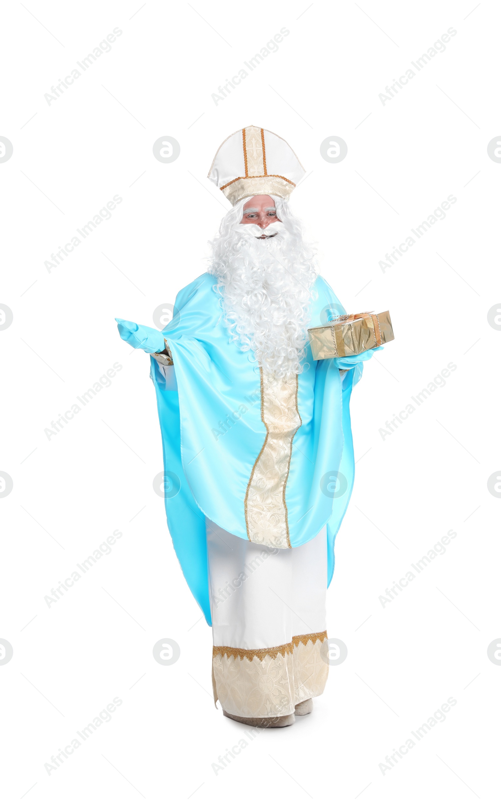 Photo of Full length portrait of Saint Nicholas with present on white background