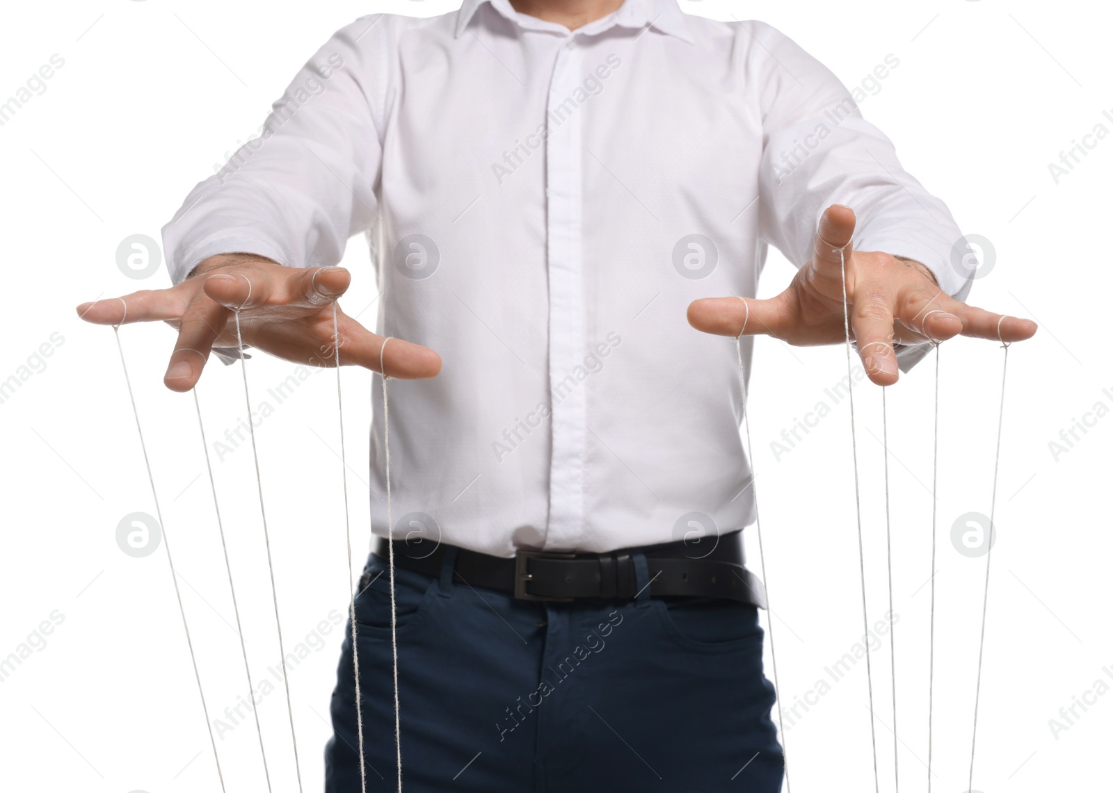 Photo of Man in formal outfit pulling strings of puppet on white background, closeup