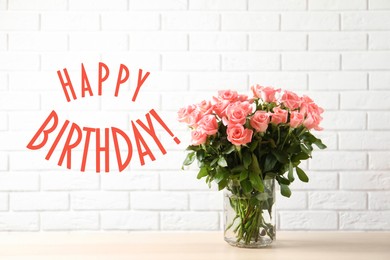 Happy Birthday! Vase with beautiful rose flowers on table near white brick wall 