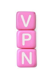 Photo of Pale pink beads with acronym VPN on white background, top view