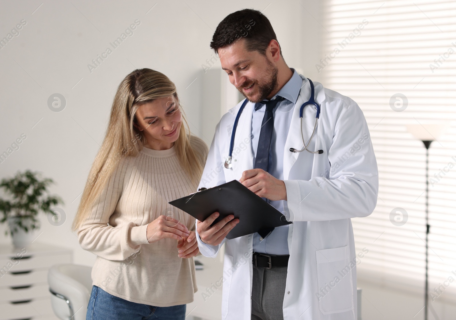 Photo of Professional doctor working with patient in hospital