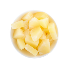 Photo of Pieces of delicious canned pineapple in bowl on white background, top view