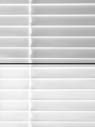 Window blinds before and after cleaning, closeup