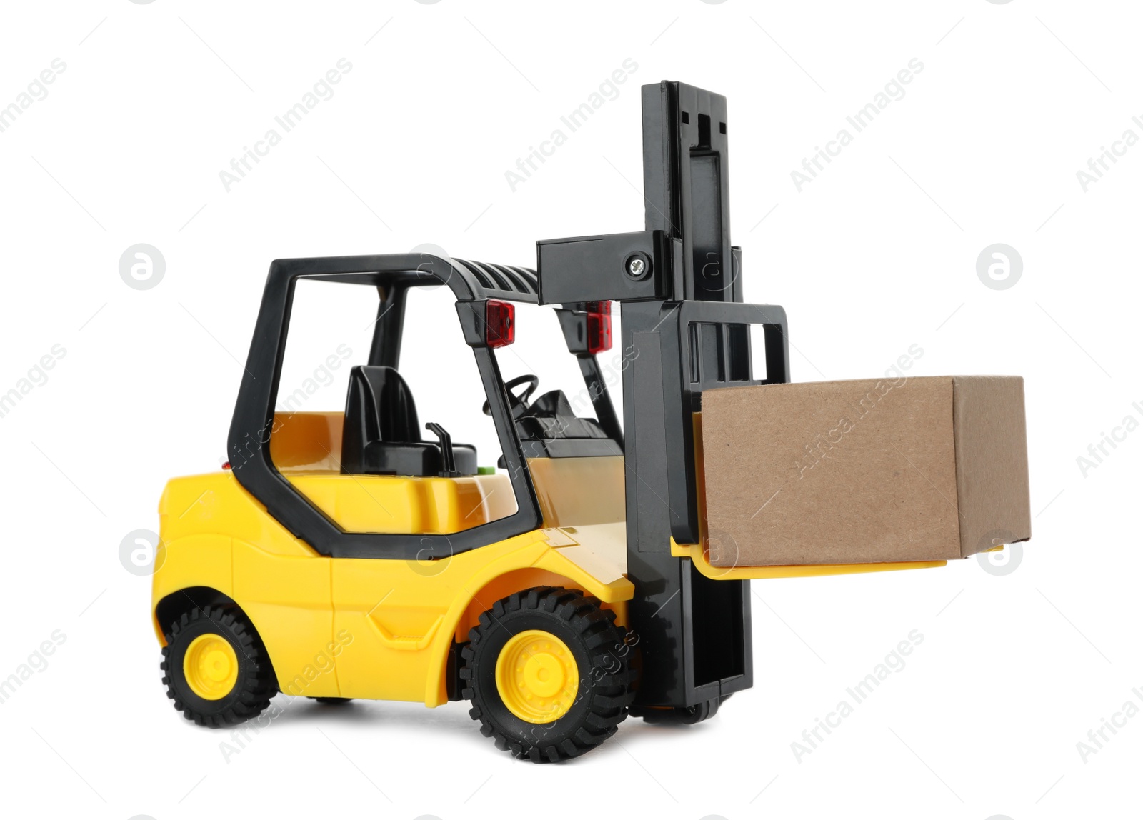 Photo of Toy forklift with box isolated on white. Logistics and wholesale concept