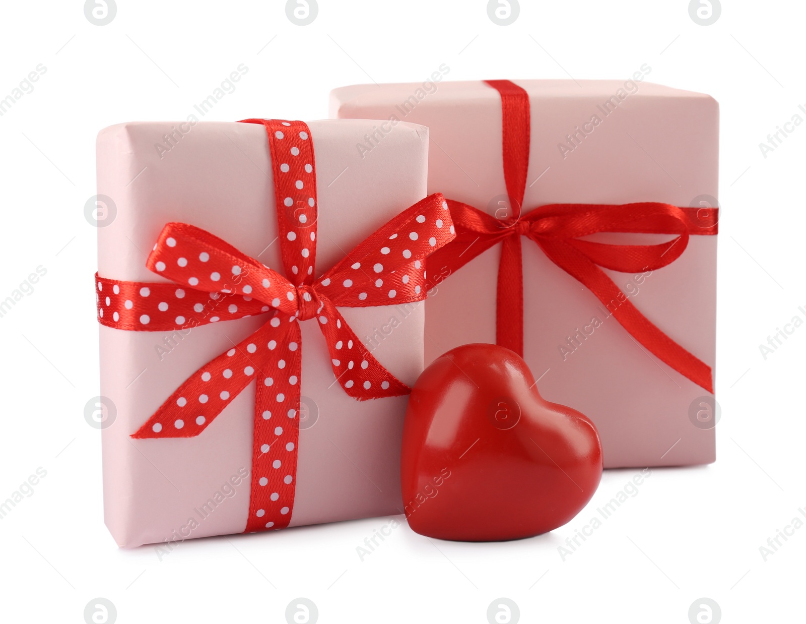 Photo of Beautiful gift boxes with decorative red heart isolated on white