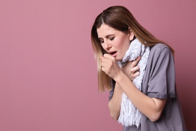 Photo of Woman coughing on color background
