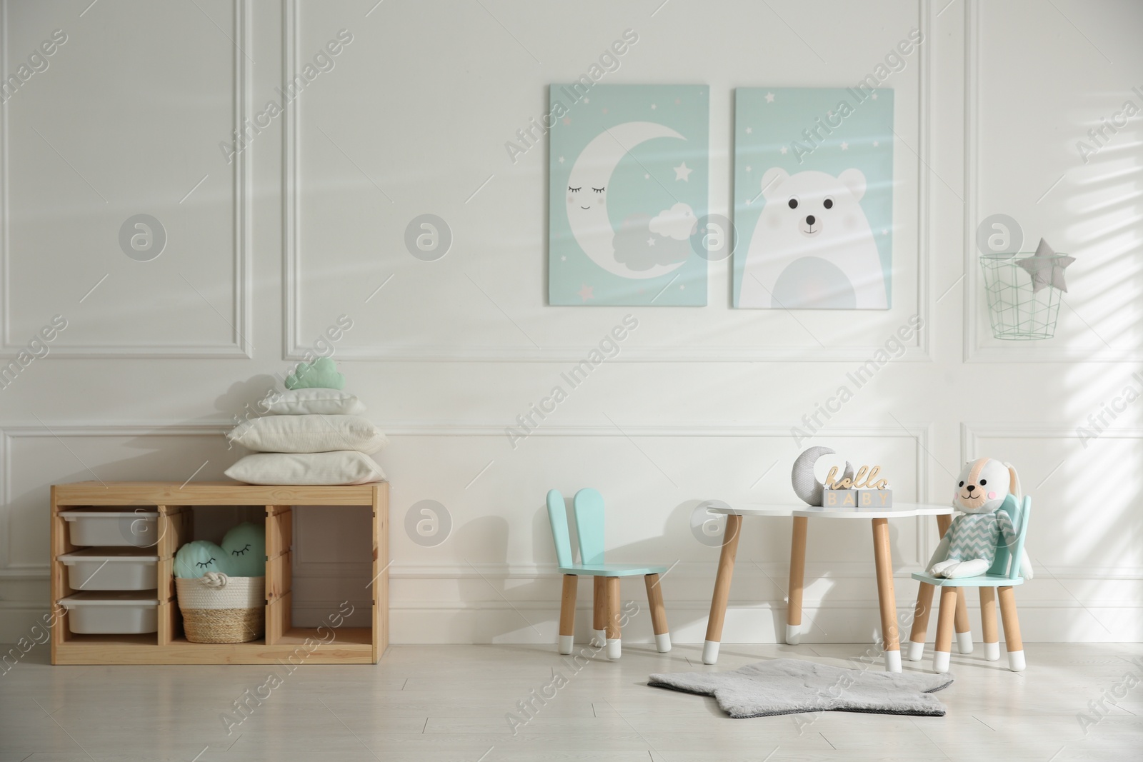 Photo of Baby room interior with stylish furniture and toys