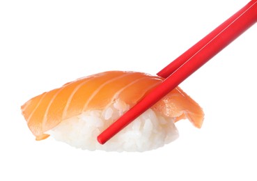 Photo of Chopsticks with delicious nigiri sushi isolated on white