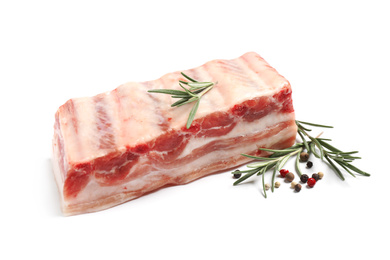 Raw ribs with rosemary and pepper on white background