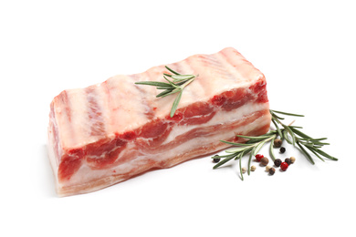 Photo of Raw ribs with rosemary and pepper on white background