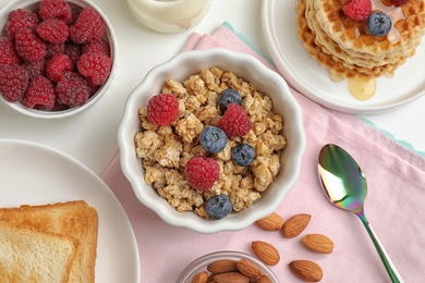Photo of Healthy breakfast served on white table, flat lay