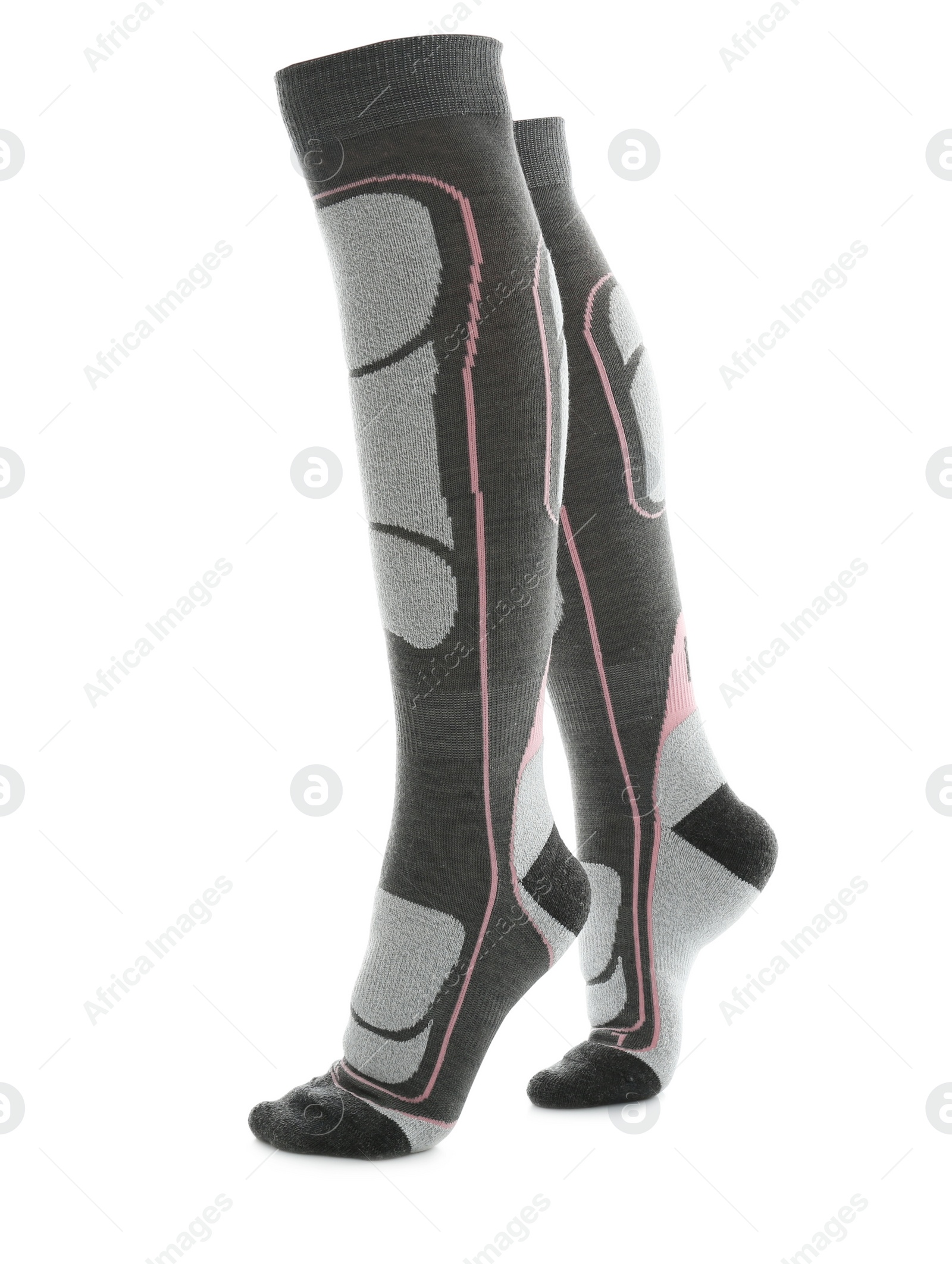 Photo of Woman wearing thermal knee socks on white background, closeup of legs. Winter sport clothes