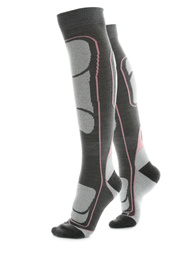 Photo of Woman wearing thermal knee socks on white background, closeup of legs. Winter sport clothes