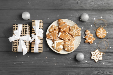 Photo of Flat lay composition with tasty homemade Christmas cookies on wooden table