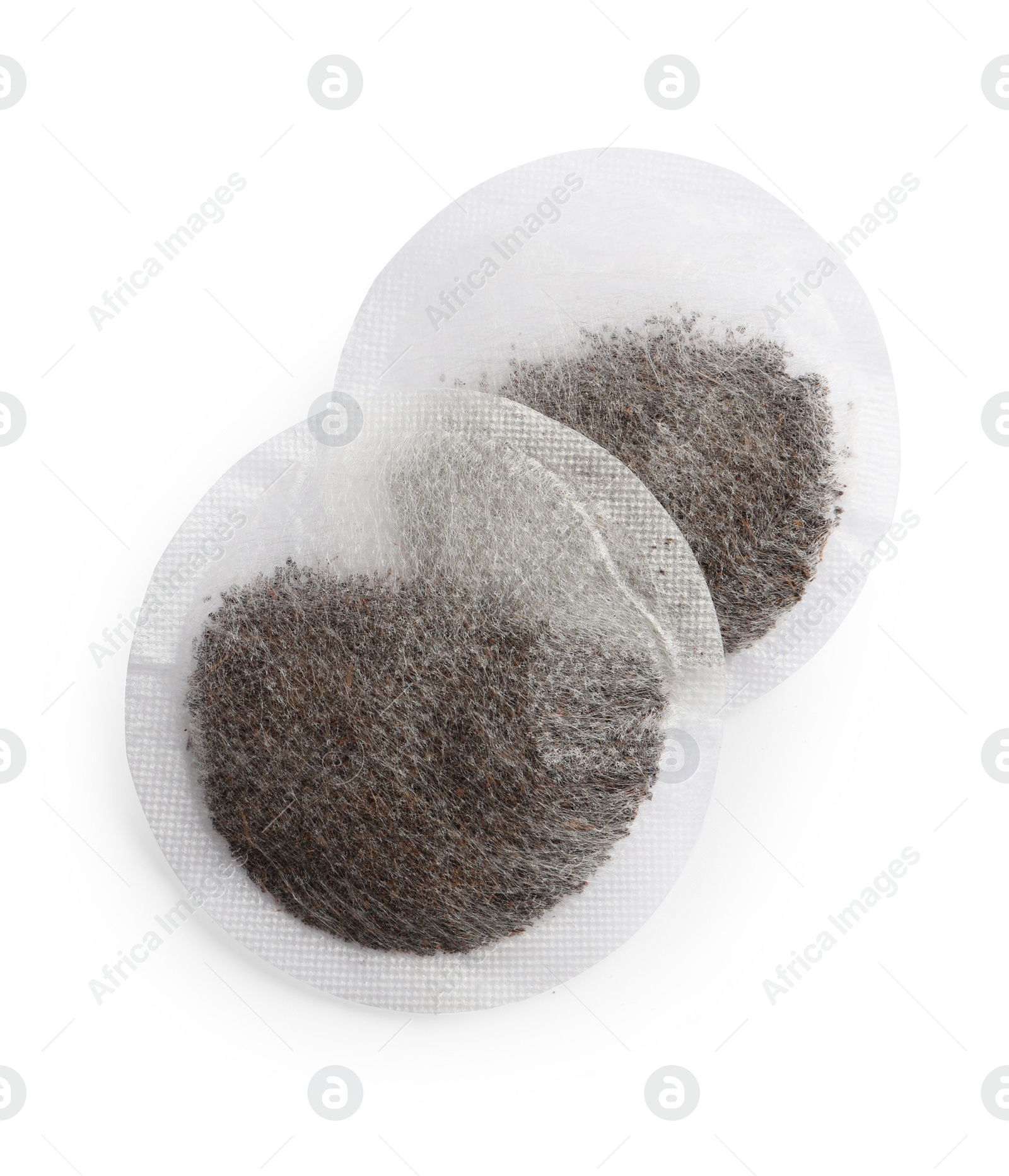 Photo of New round tea bags on white background, top view