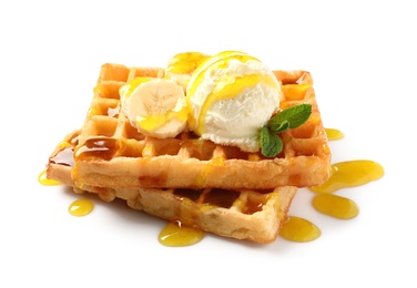 Photo of Delicious waffles with ice cream, banana and syrup on white background