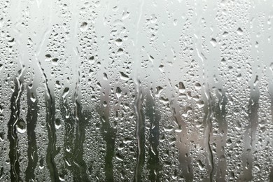 Window glass with raindrops as background, closeup