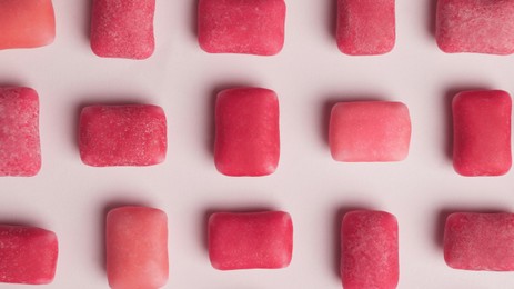 Photo of Sweet chewing gums on white background, top view