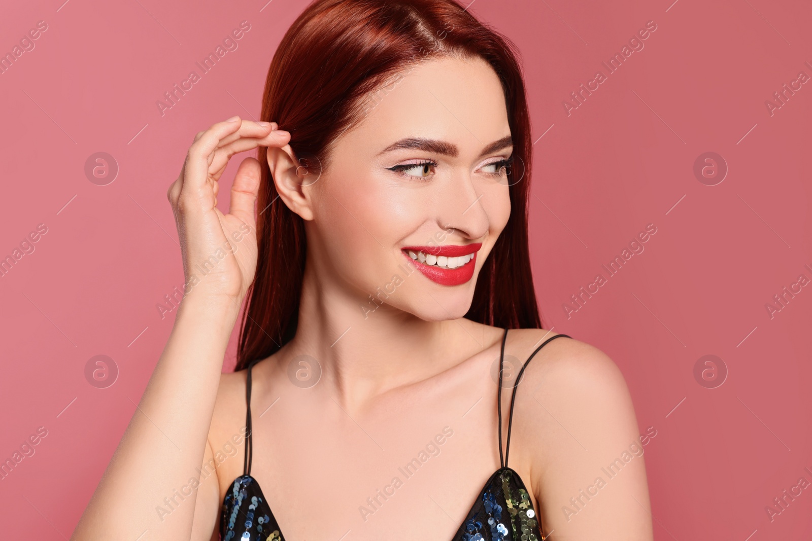 Photo of Happy woman with red dyed hair on pink background