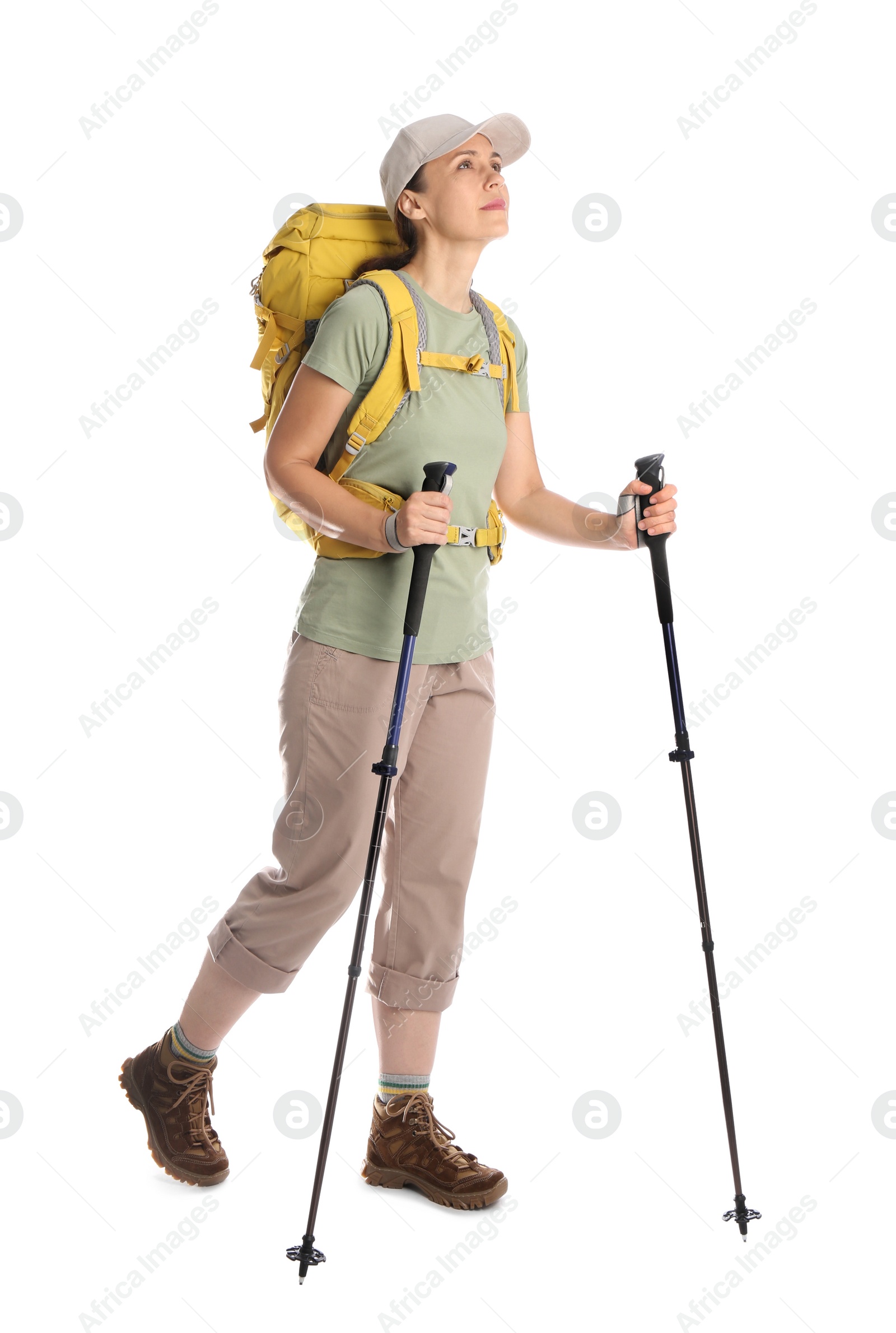 Photo of Female hiker with backpack and trekking poles on white background