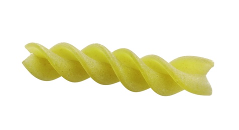 Uncooked fusilli pasta on white background, top view