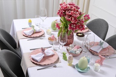 Photo of Festive table setting with beautiful flowers. Easter celebration