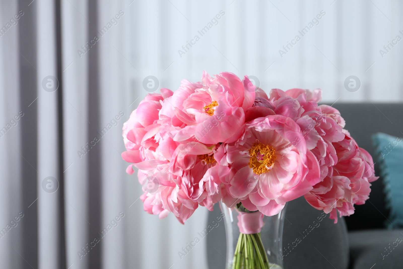 Photo of Beautiful bouquet of pink peonies in vase indoors