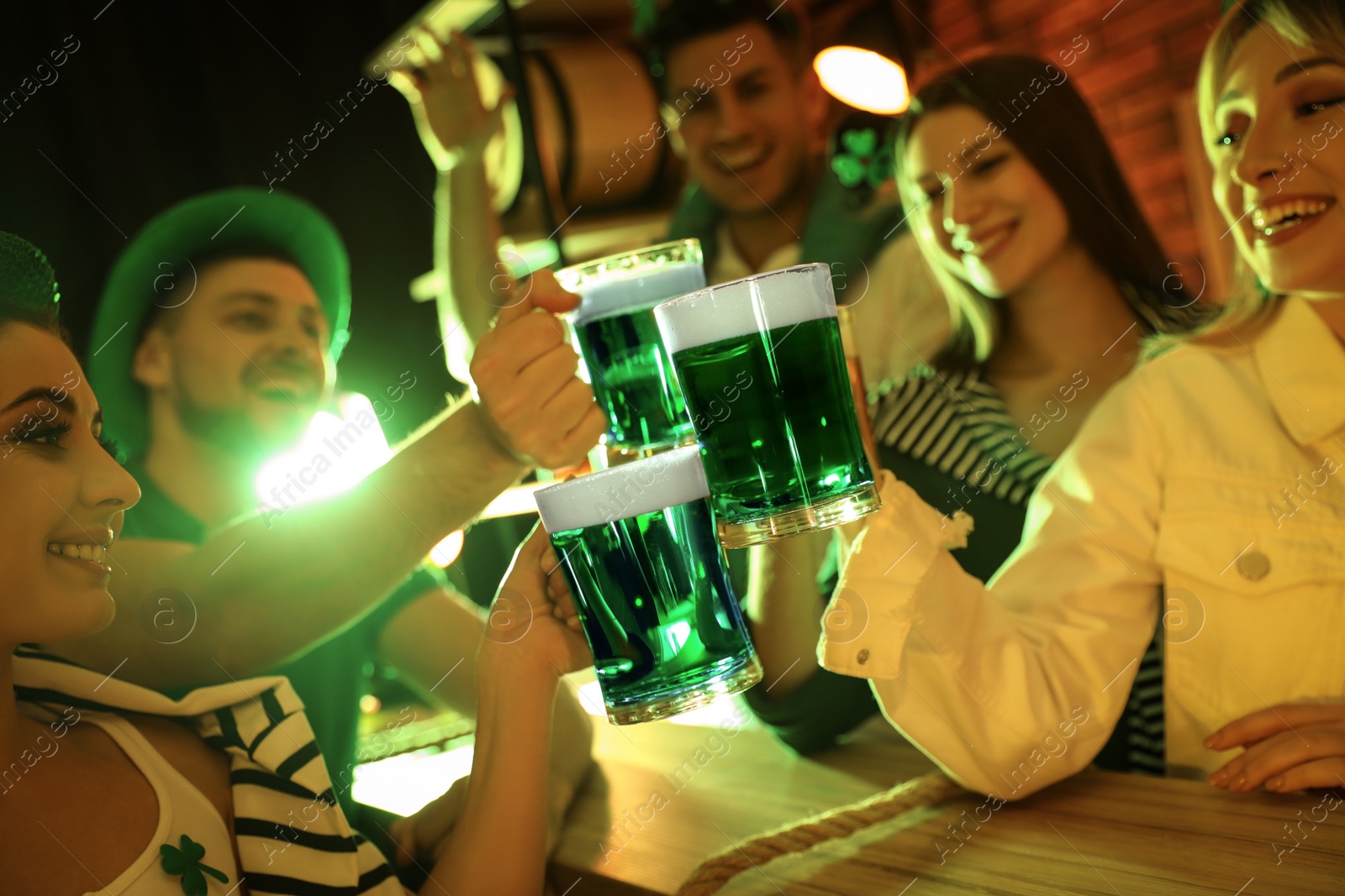 Photo of People with beer celebrating St Patrick's day in pub