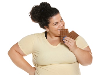 Photo of Happy overweight woman with chocolate on white background