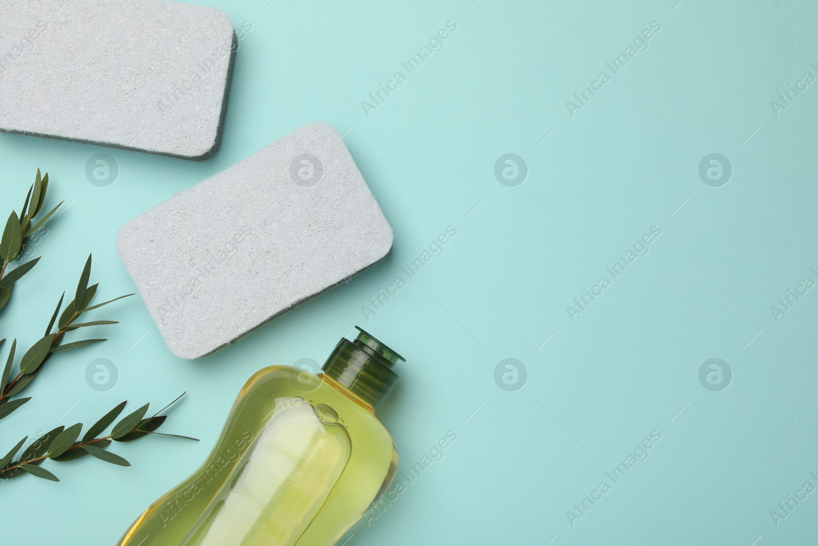 Photo of Flat lay composition with sponges on light blue background. Space for text