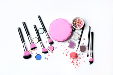 Photo of Decorative makeup products on white background