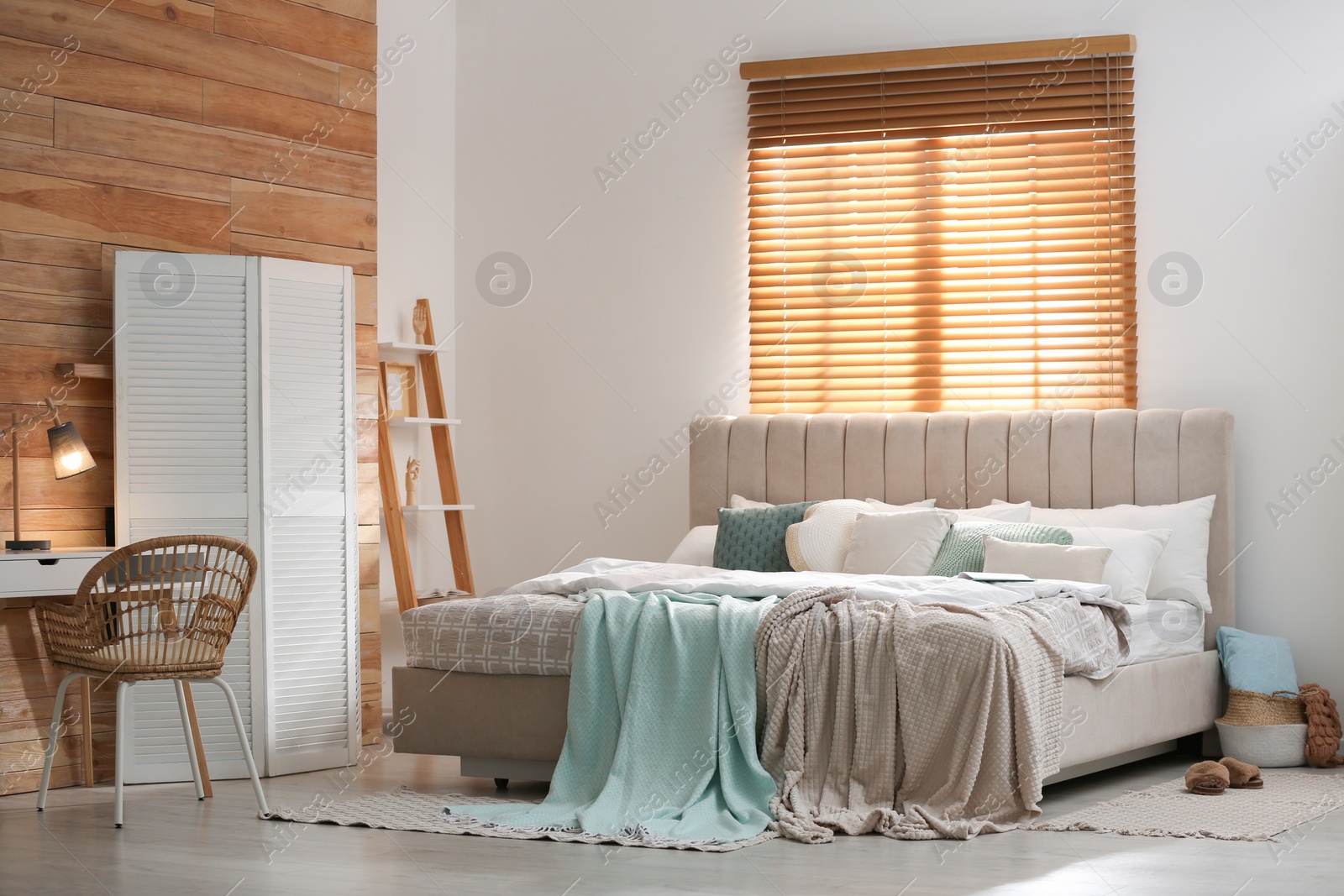 Photo of Stylish room interior with big comfortable bed