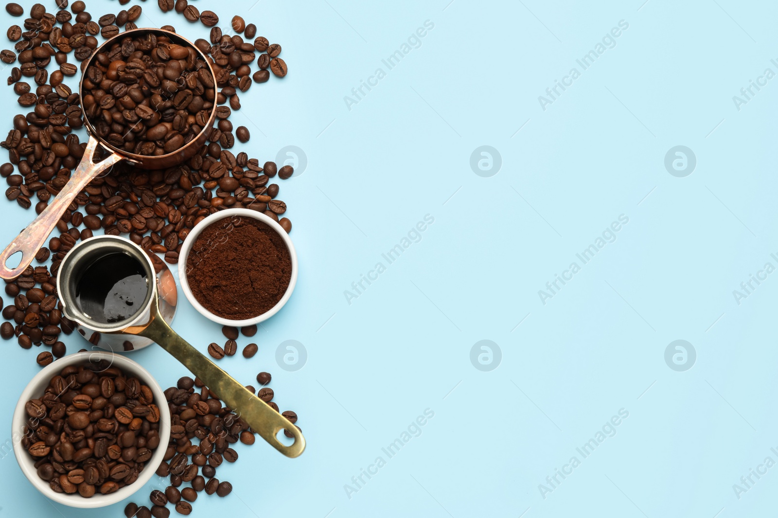 Photo of Flat lay composition with ground coffee and roasted beans on light blue background, space for text