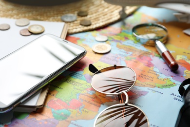 Photo of Different items on world map. Travel during summer vacation