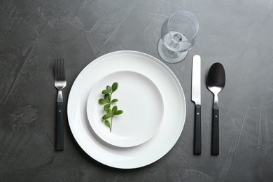 Elegant table setting on grey background, flat lay