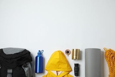 Photo of Flat lay composition with different camping equipment on white background