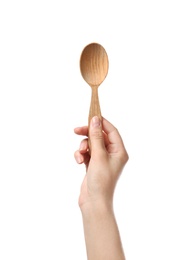 Photo of Woman holding clean wooden spoon on white background, closeup