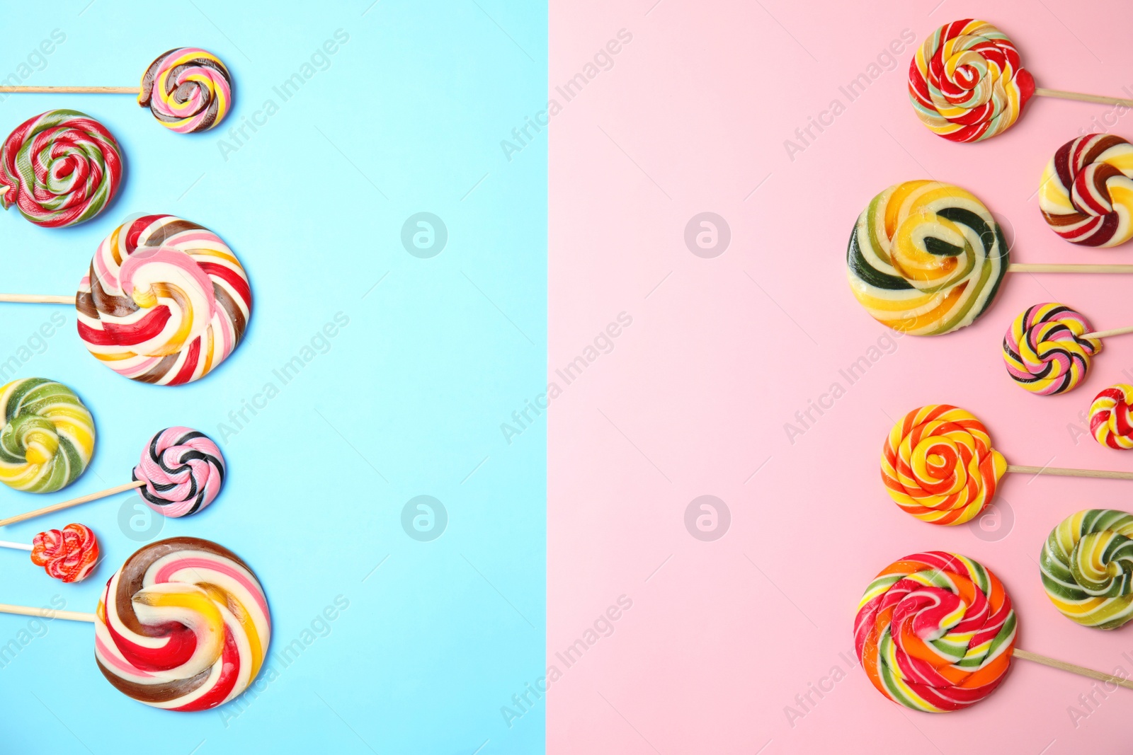 Photo of Flat lay composition with different yummy candies and space for text on color background