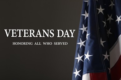 Veterans day. Honoring all who served. American flag on dark background