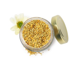 Photo of Fresh bee pollen granules in jar and flower isolated on white, top view