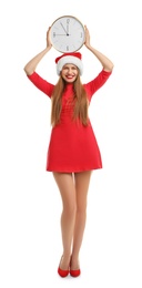 Photo of Young beautiful woman in Santa hat holding big clock on white background. Christmas celebration