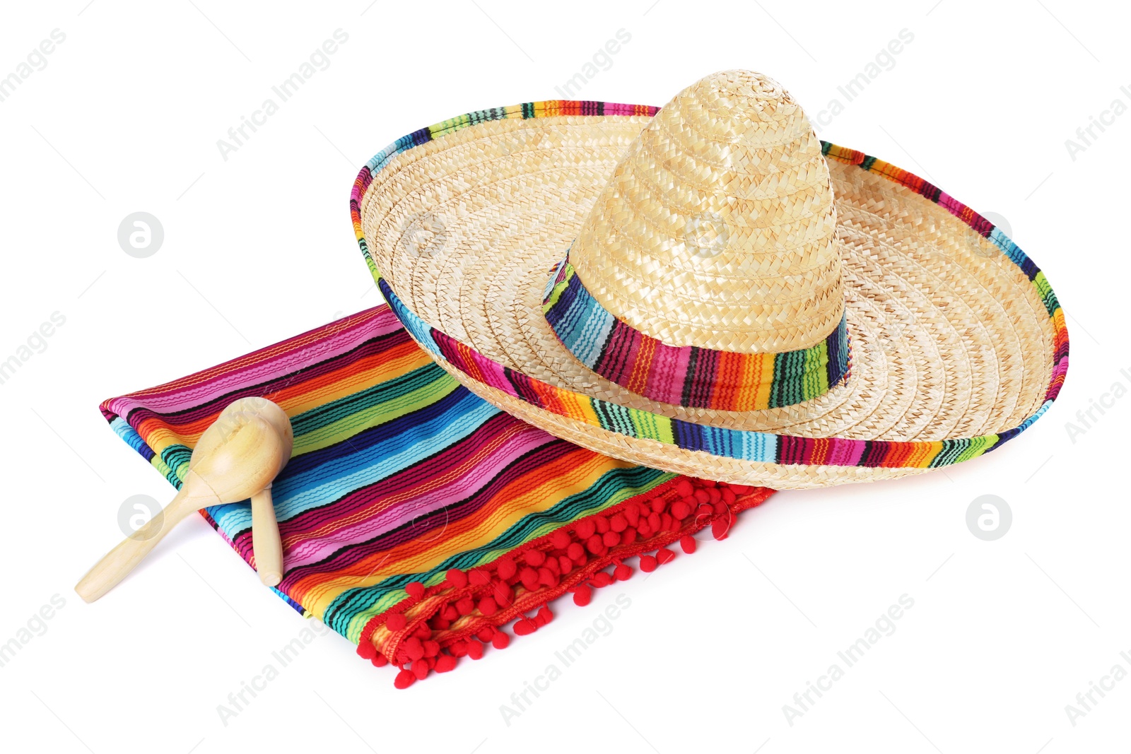 Photo of Mexican sombrero hat, maracas and colorful poncho isolated on white