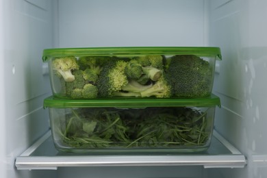 Photo of Glass containers with different fresh products in fridge. Food storage