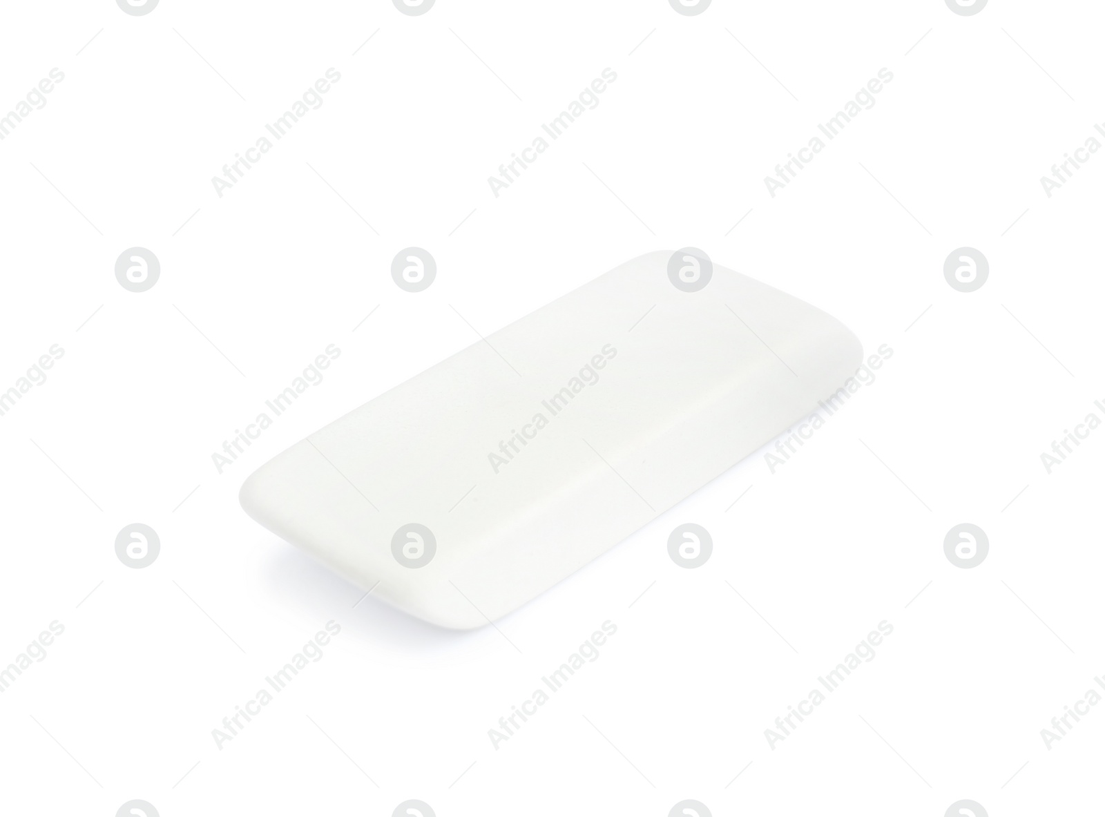 Photo of New eraser isolated on white. School stationery